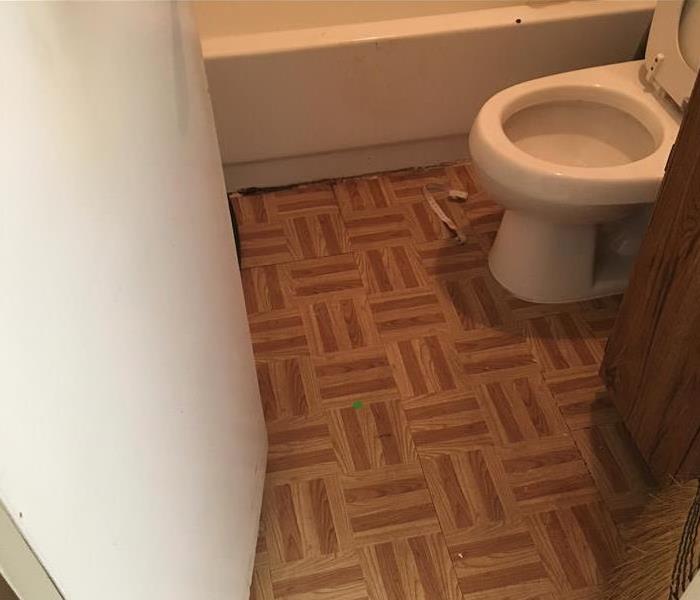 Warped flooring due to a toilet overflow