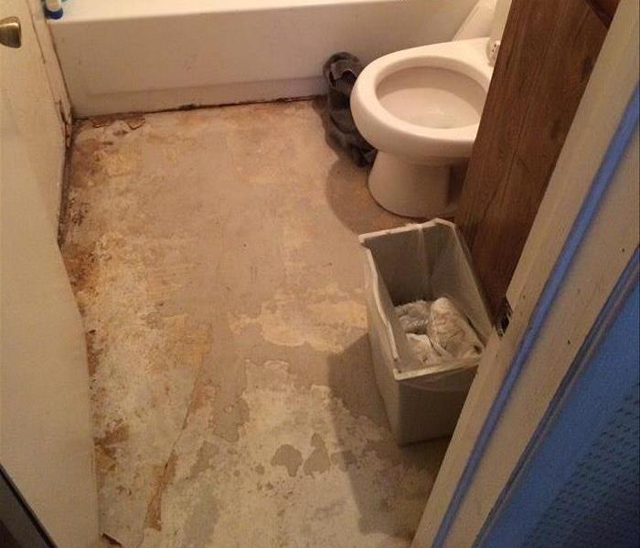 Removed flooring in a bathroom after drying