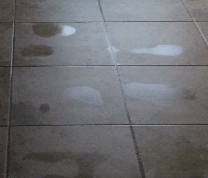 Tiles with puddles of water